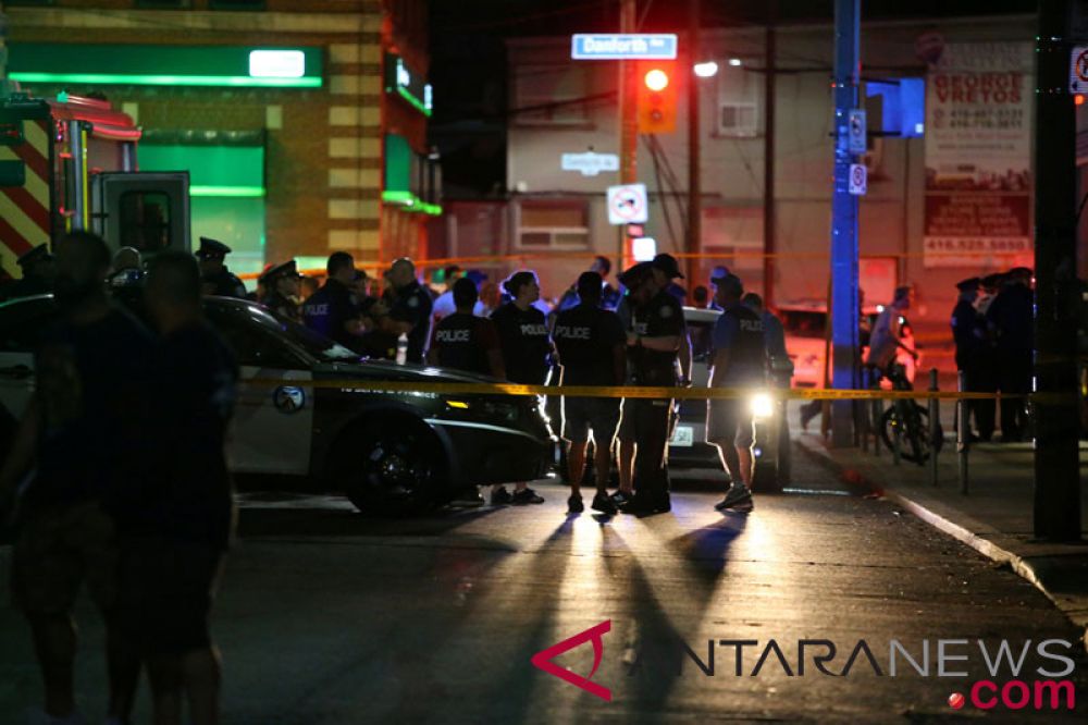 Ilustrasi: Sejumlah polisi terlihat berjaga di lokasi penembakan massal di Toronto, Kanada, Minggu (22/7/2018). ANTARA/REUTERS/Chris Helgren/TM