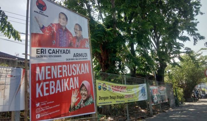 Baliho Eri Cahyadi-Armuji yang memasang foto Tri Rismaharini dinilai tidak melanggar